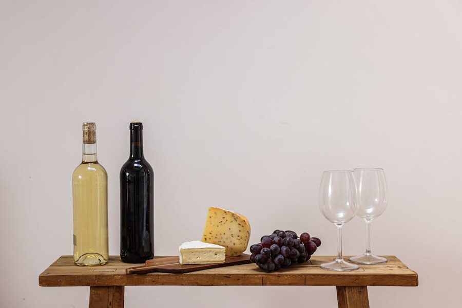 Wine and cheese set on a wooden table