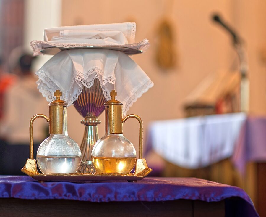 Holy water and sacramental wine on an altar