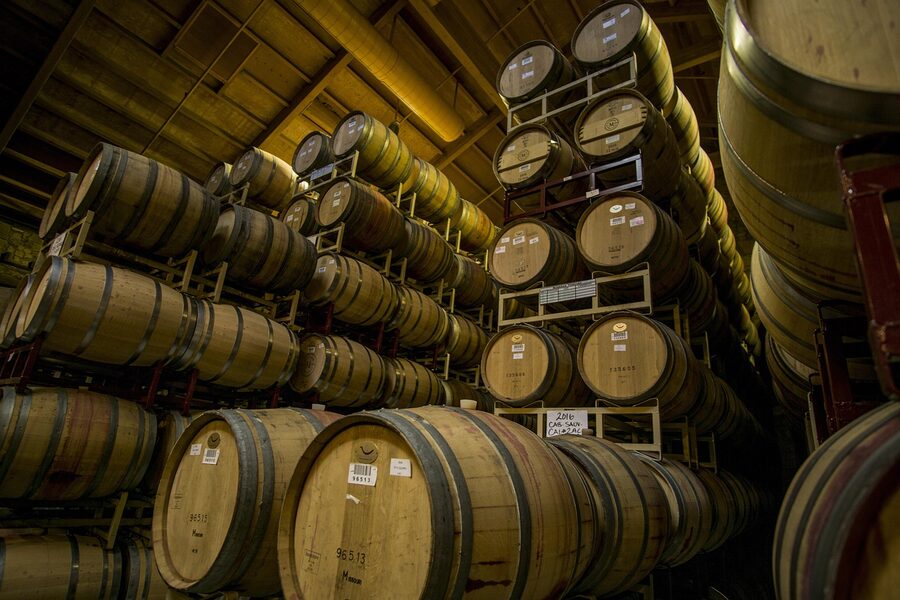 Wine cellar with rows of oak barrels