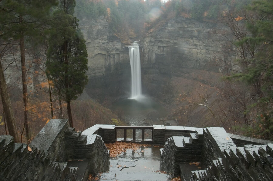 Taughannock Falls in autumn with surrounding fall foliage