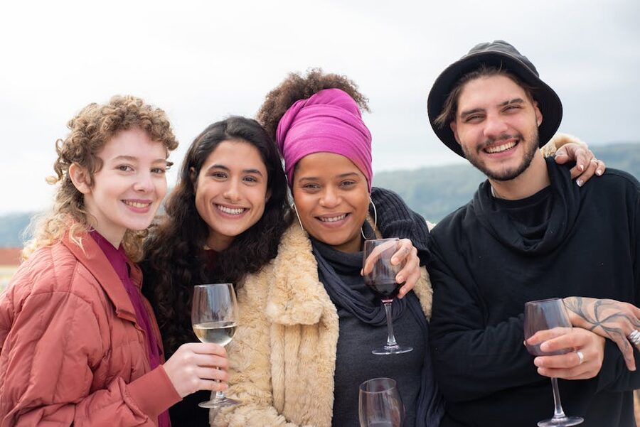 Group of friends sharing wine outdoors at a tasting