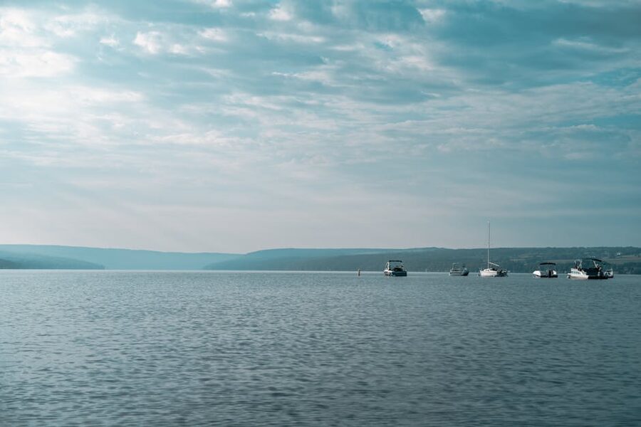 Boats on a Finger Lake under a cloudy sky