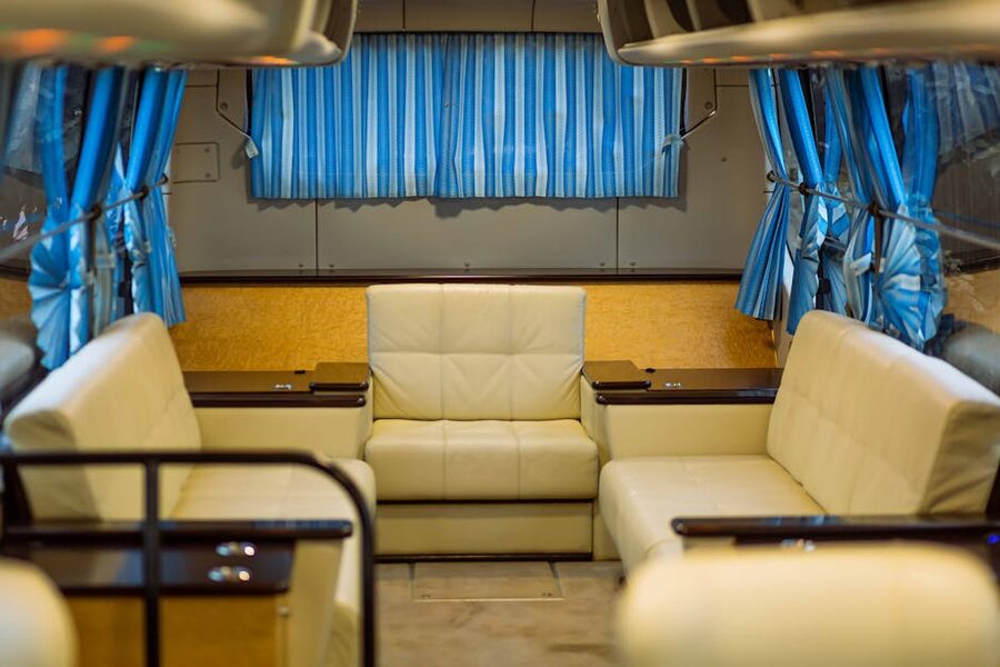 Spacious tour van interior with leather seats