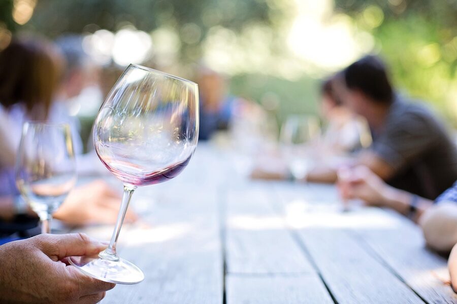Wine being poured at a vineyard tasting