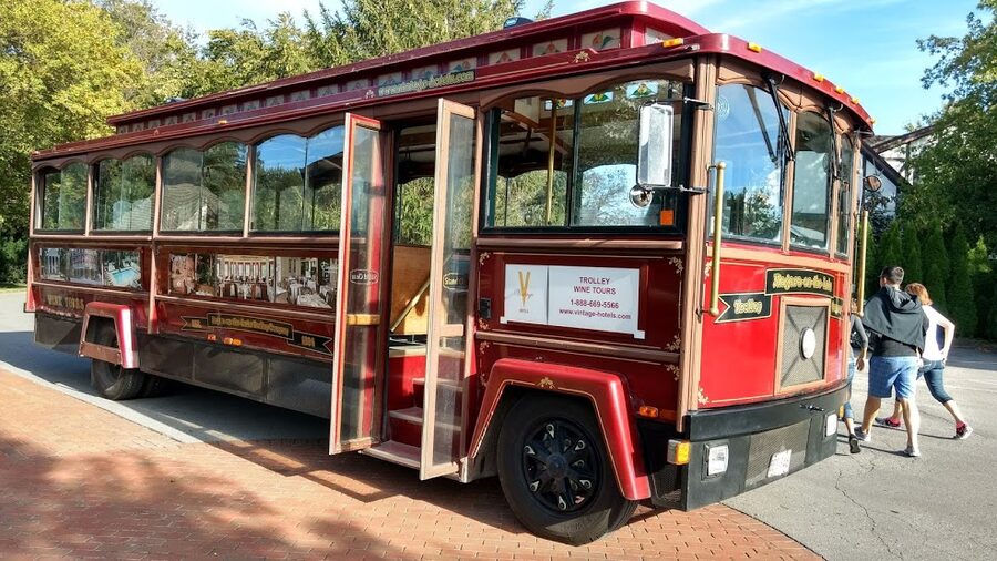 Wine tour bus at a winery, painted with wine country branding