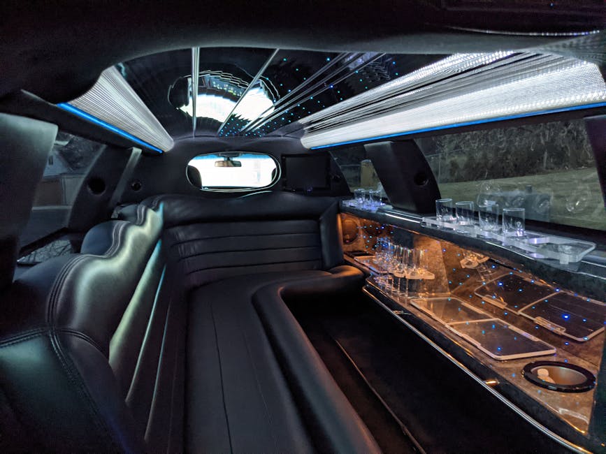 Plush interior of a luxury stretch limousine with LED lighting