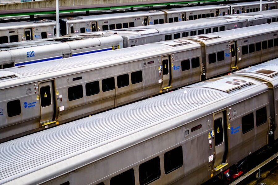 Long Island Rail Road silver train cars at a New York station