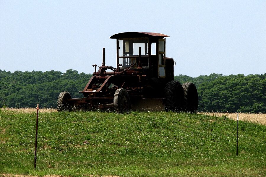A tractor working a North Fork field, the rural reality outside the Macari tasting room