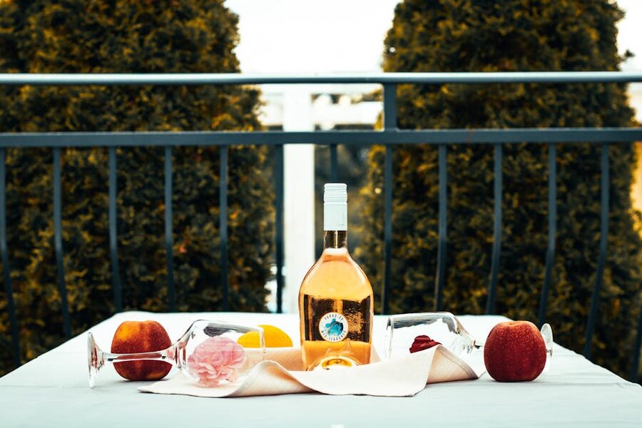 Chilled rose wine outdoors with summer fruits, peak rosé season at Macari