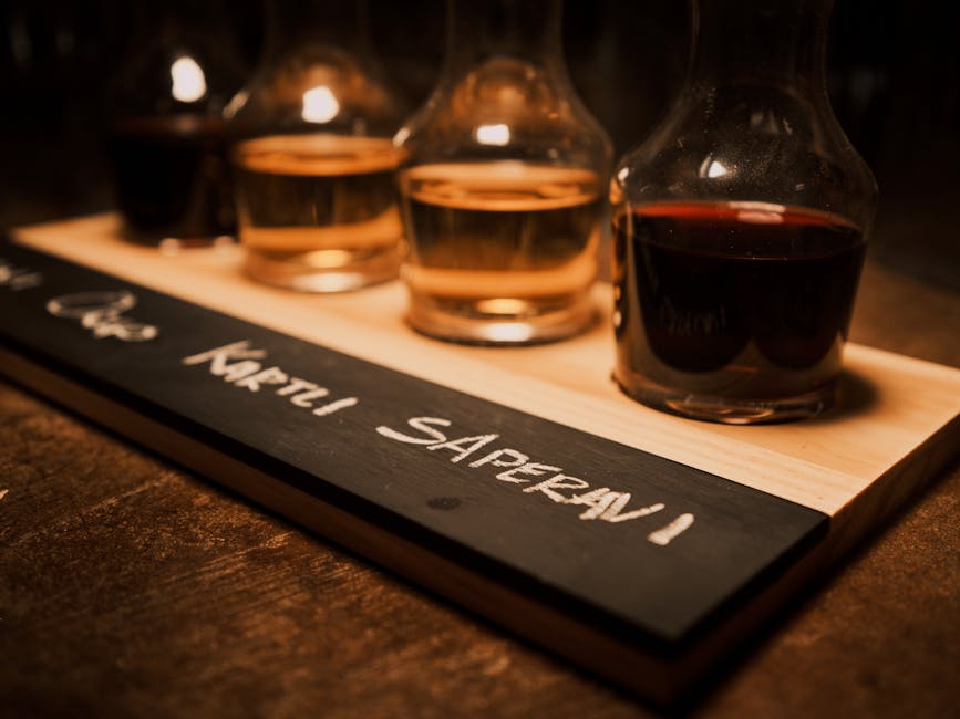 A wine tasting flight on a chalkboard tray