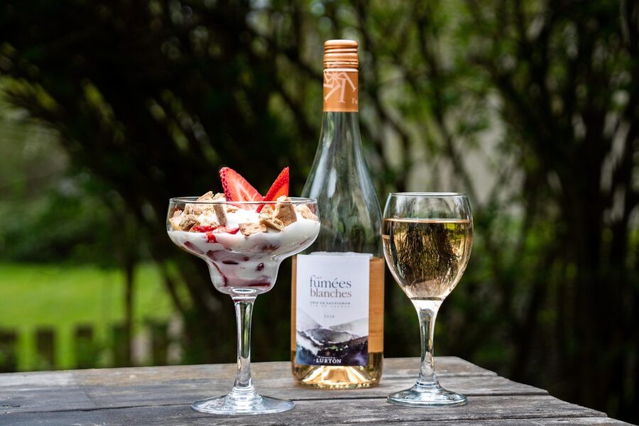 A glass of rose wine on a summer table outdoors