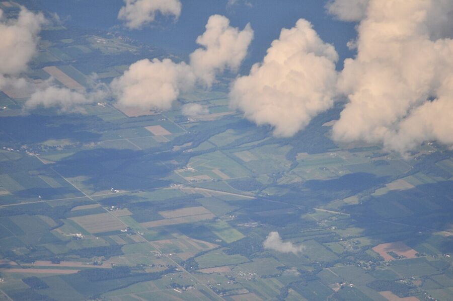 Aerial view of Route 96 east of Ovid NY with Cayuga Lake visible in the distance