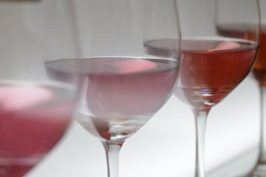 Glasses of rosé wine in soft light at a tasting