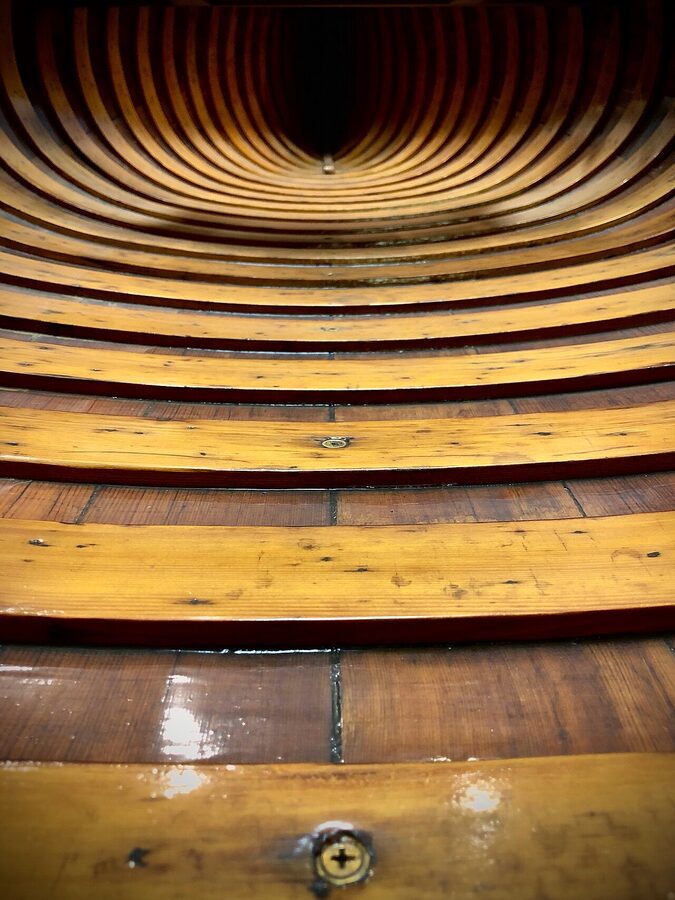 A vintage wooden canoe on display at the Finger Lakes Boating Museum